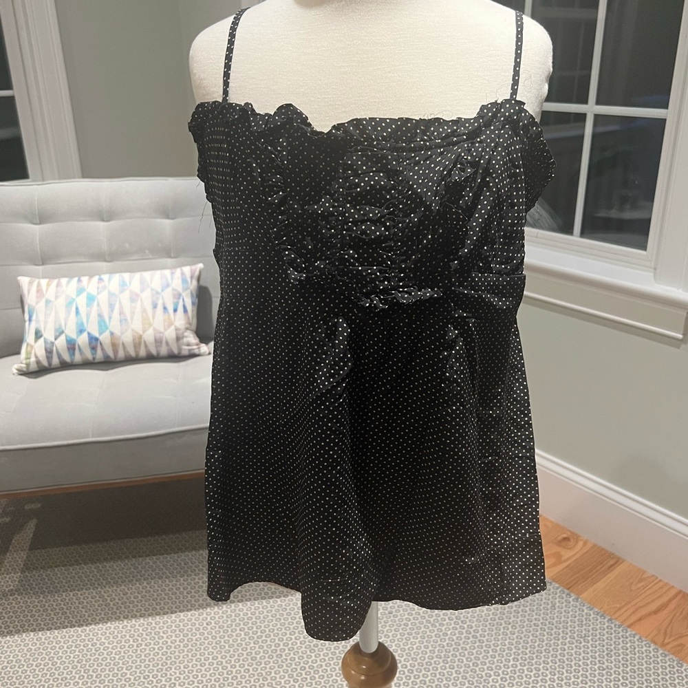 Polka dot cami with front ruffle bib detail.